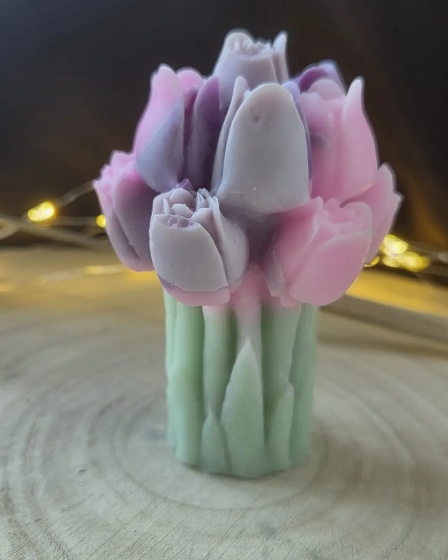 Candle shaped like a bunch of pink and lilac tulips