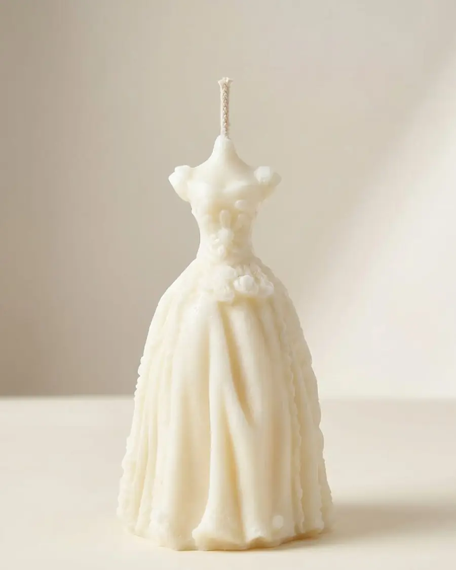 Ivory wedding dress candle with a fitted lace gown